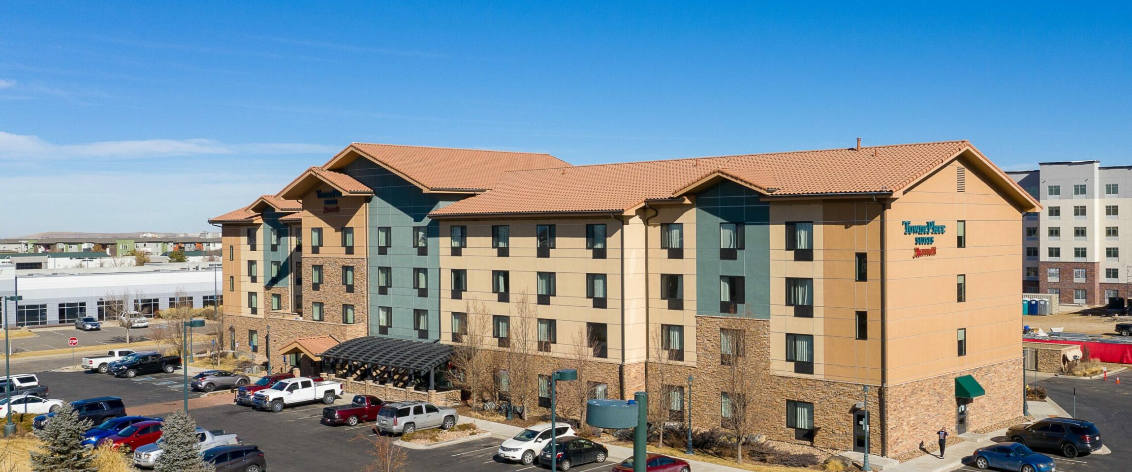 Aerial Shots - Exterior Front (2) Pennbridge acquired the 99 room Marriott TownePlace Suites Denver Airport @ Gateway Park in May of 2021. The Hotel is located in the middle of Gateway Park which is only 4 miles from the Green Valley Ranch Golf Club, 6 miles from the Aurora Fox Arts Center, and 11 miles… Continue Reading..